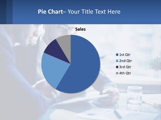 Two Men In Business Suits Sitting At A Table Looking At A Cell Phone PowerPoint Template