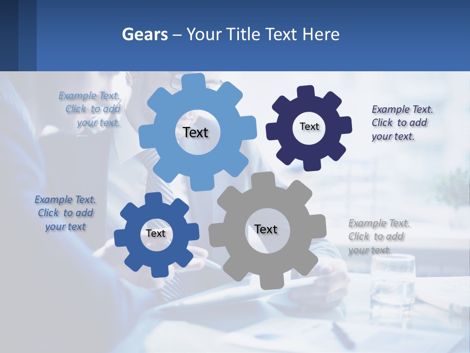 Two Men In Business Suits Sitting At A Table Looking At A Cell Phone PowerPoint Template