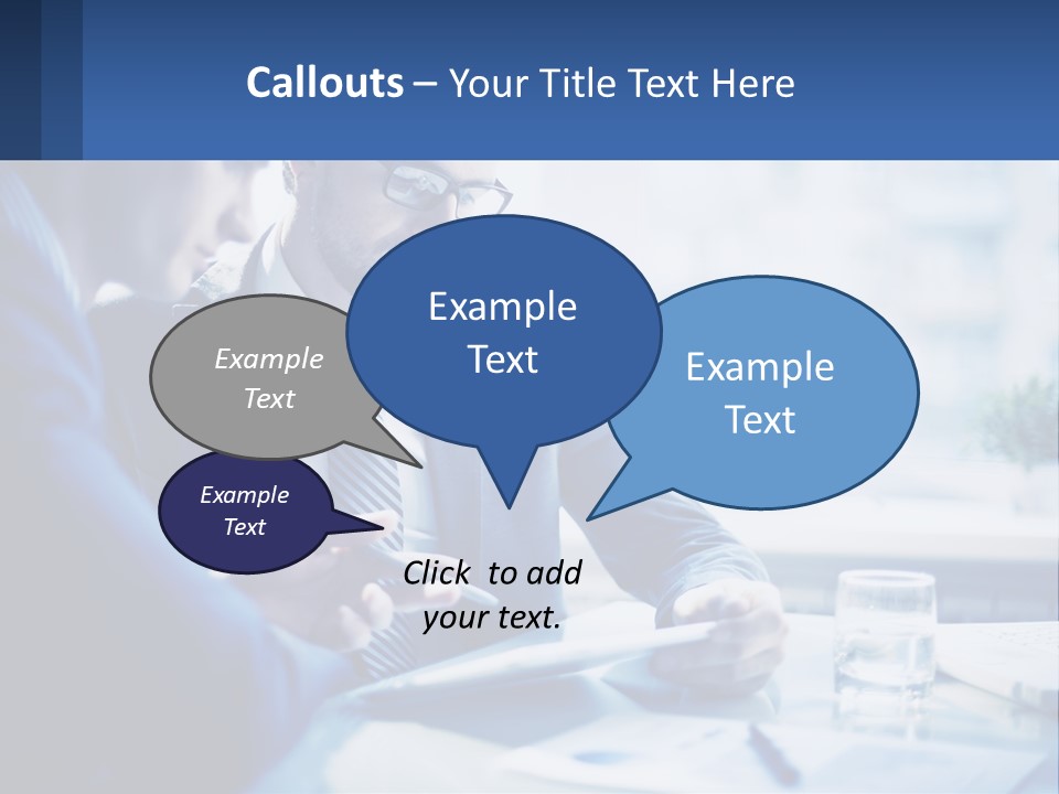 Two Men In Business Suits Sitting At A Table Looking At A Cell Phone PowerPoint Template