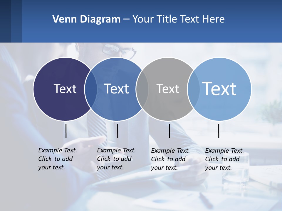 Two Men In Business Suits Sitting At A Table Looking At A Cell Phone PowerPoint Template