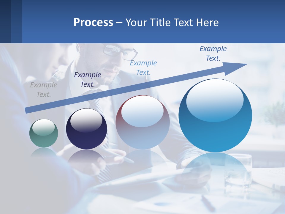 Two Men In Business Suits Sitting At A Table Looking At A Cell Phone PowerPoint Template