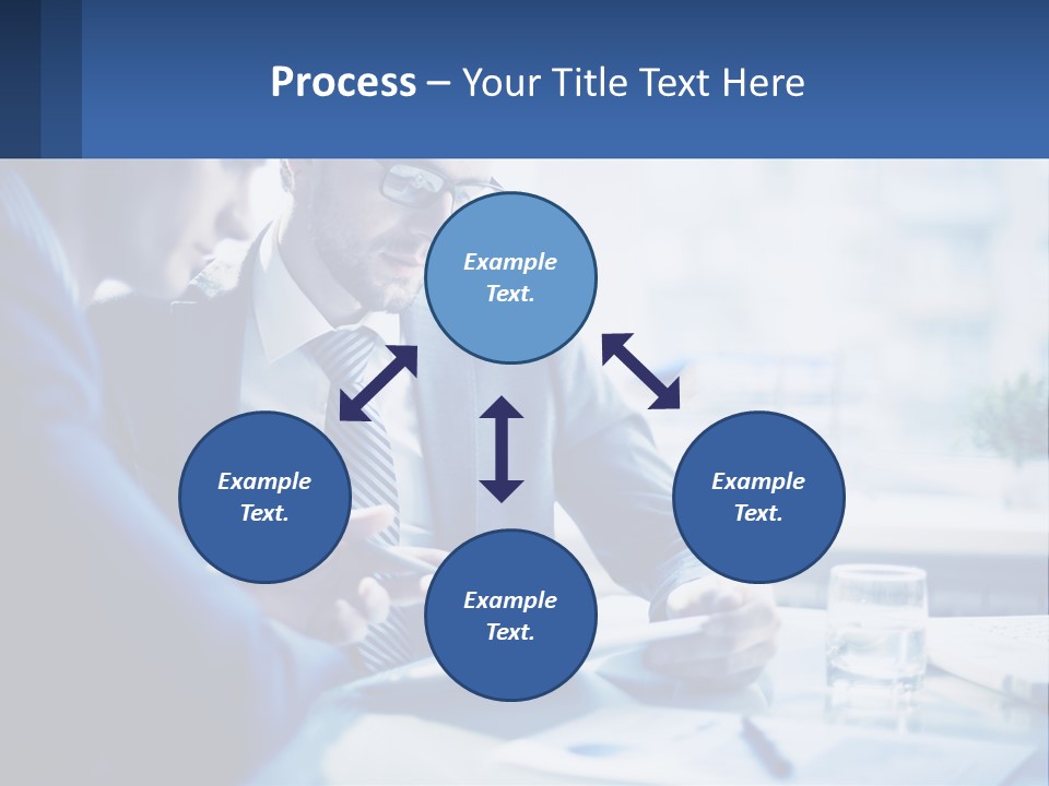Two Men In Business Suits Sitting At A Table Looking At A Cell Phone PowerPoint Template