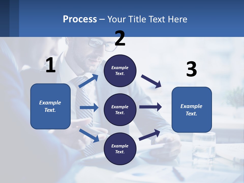 Two Men In Business Suits Sitting At A Table Looking At A Cell Phone PowerPoint Template