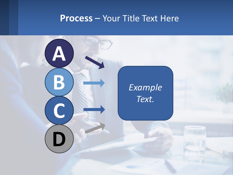 Two Men In Business Suits Sitting At A Table Looking At A Cell Phone PowerPoint Template