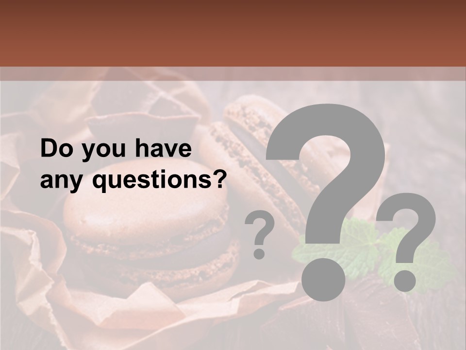 A Table Topped With Cookies And Chocolates On Top Of A Wooden Table PowerPoint Template