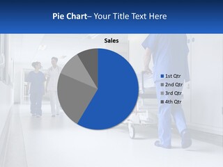 A Group Of Doctors Walking Down A Hospital Hallway PowerPoint Template