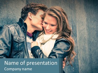 A Man And A Woman Kissing In Front Of A Wall PowerPoint Template