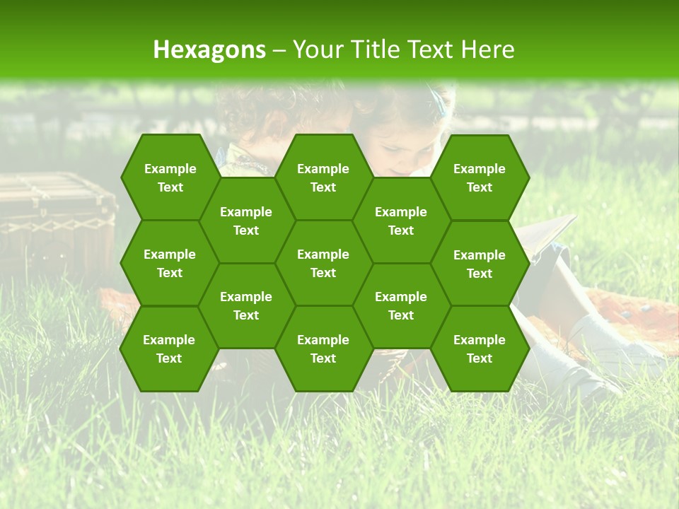 Two Children Reading A Book In The Grass PowerPoint Template