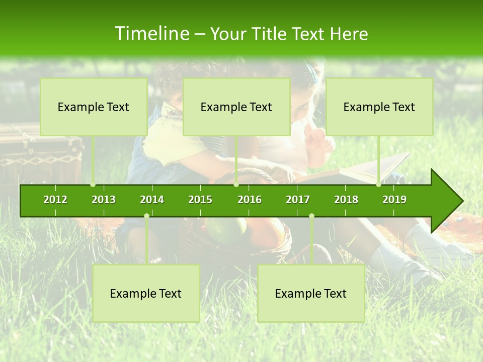 Two Children Reading A Book In The Grass PowerPoint Template