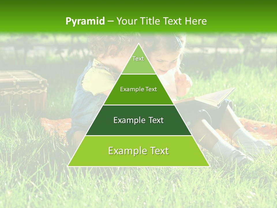Two Children Reading A Book In The Grass PowerPoint Template