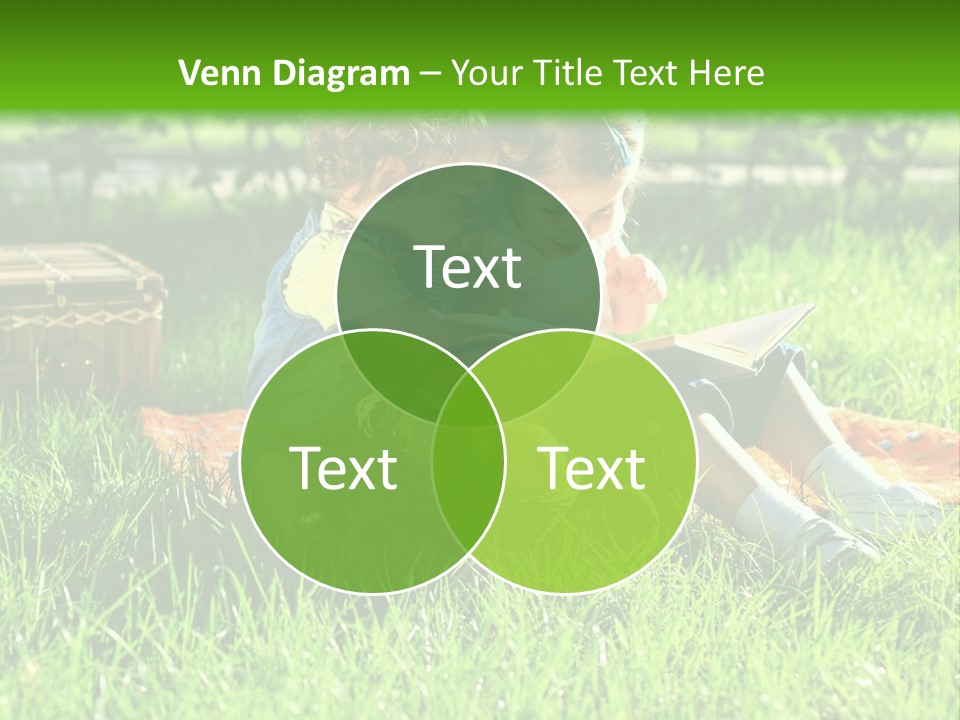 Two Children Reading A Book In The Grass PowerPoint Template