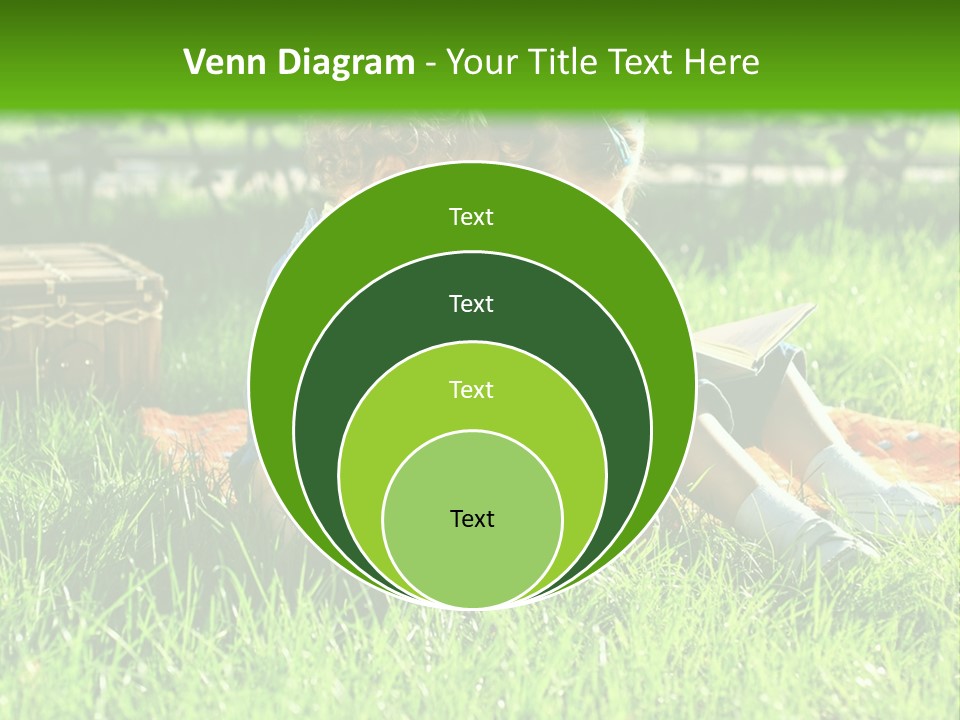 Two Children Reading A Book In The Grass PowerPoint Template