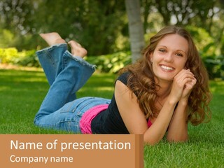 A Beautiful Woman Laying On The Grass In A Park PowerPoint Template