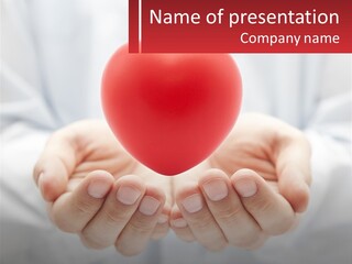 A Person Holding A Red Heart In Their Hands PowerPoint Template