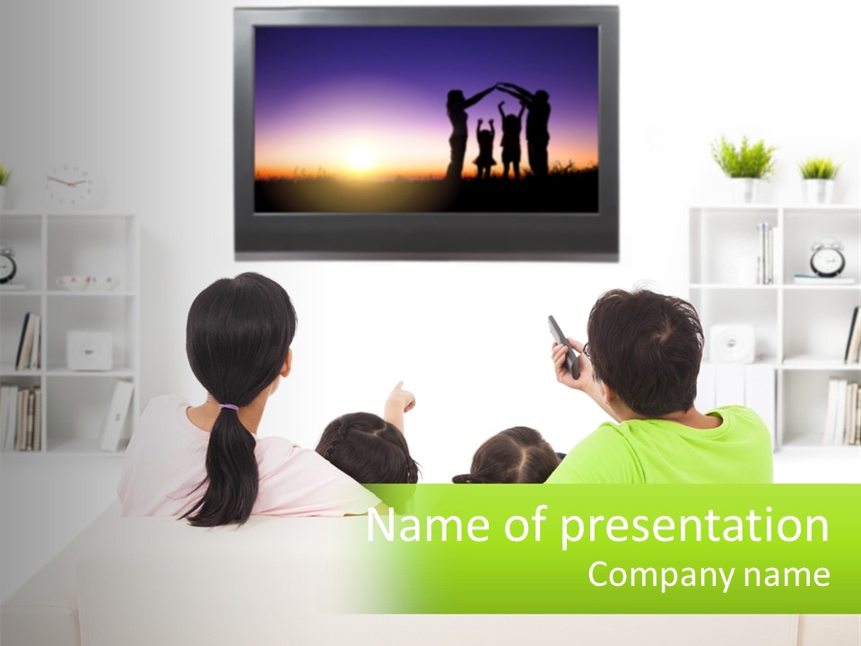 A Group Of People Sitting In Front Of A Tv PowerPoint Template