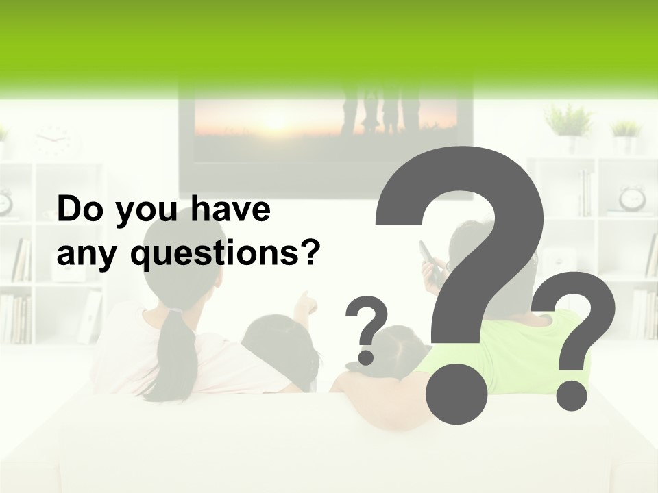 A Group Of People Sitting In Front Of A Tv PowerPoint Template