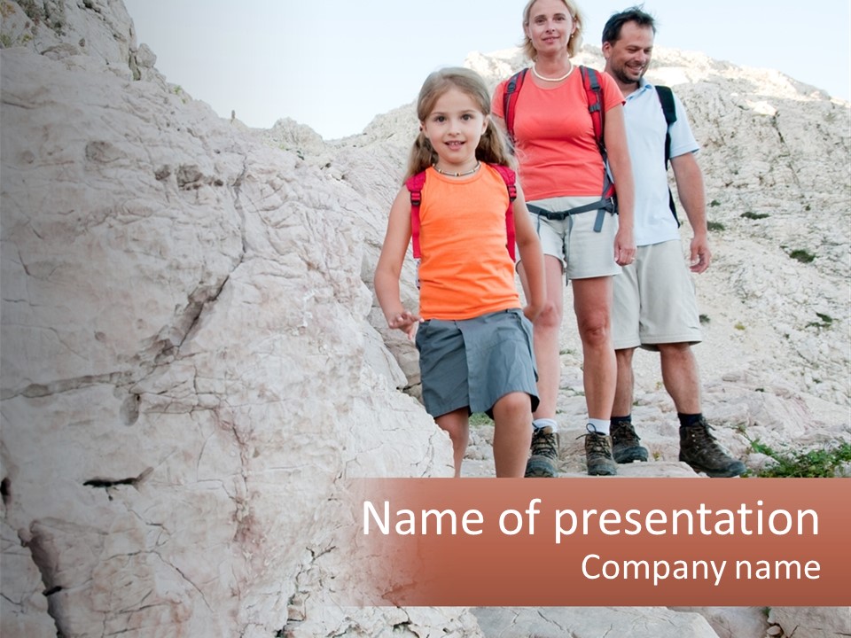 A Group Of People Standing On Top Of A Mountain PowerPoint Template