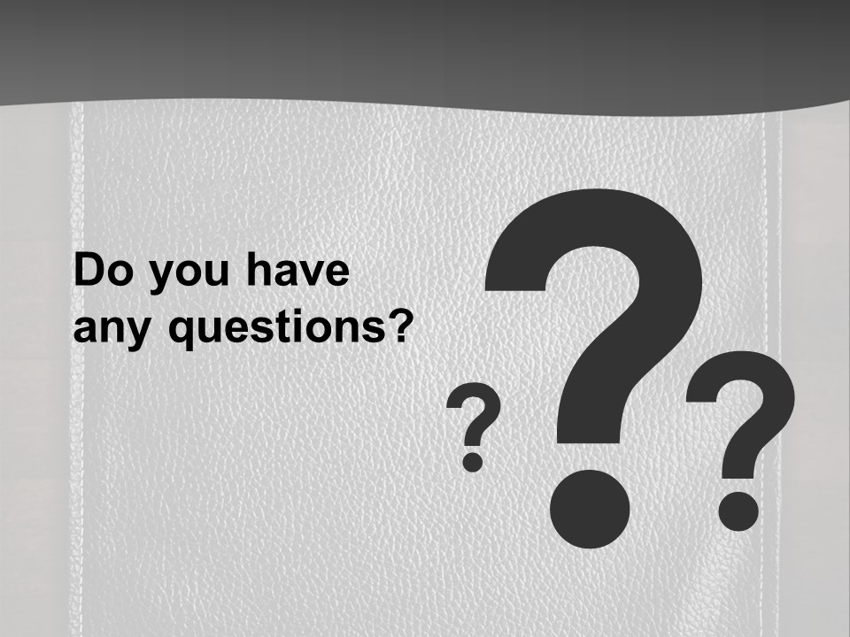 A Black Leather Book On A Wooden Table PowerPoint Template