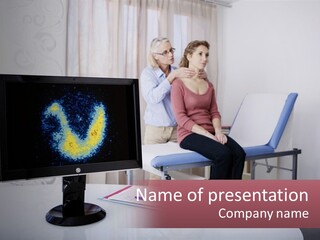 A Man And Woman Sitting In Front Of A Computer Screen PowerPoint Template