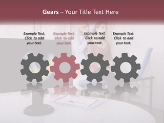 A Man And Woman Sitting In Front Of A Computer Screen PowerPoint Template