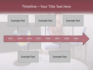 A Man And Woman Sitting In Front Of A Computer Screen PowerPoint Template