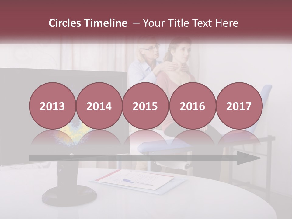 A Man And Woman Sitting In Front Of A Computer Screen PowerPoint Template