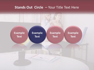 A Man And Woman Sitting In Front Of A Computer Screen PowerPoint Template