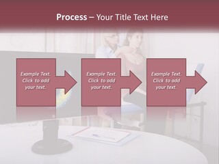 A Man And Woman Sitting In Front Of A Computer Screen PowerPoint Template