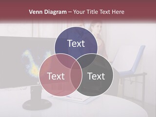 A Man And Woman Sitting In Front Of A Computer Screen PowerPoint Template