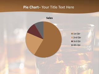 A Glass Of Whiskey With Ice On A Table PowerPoint Template