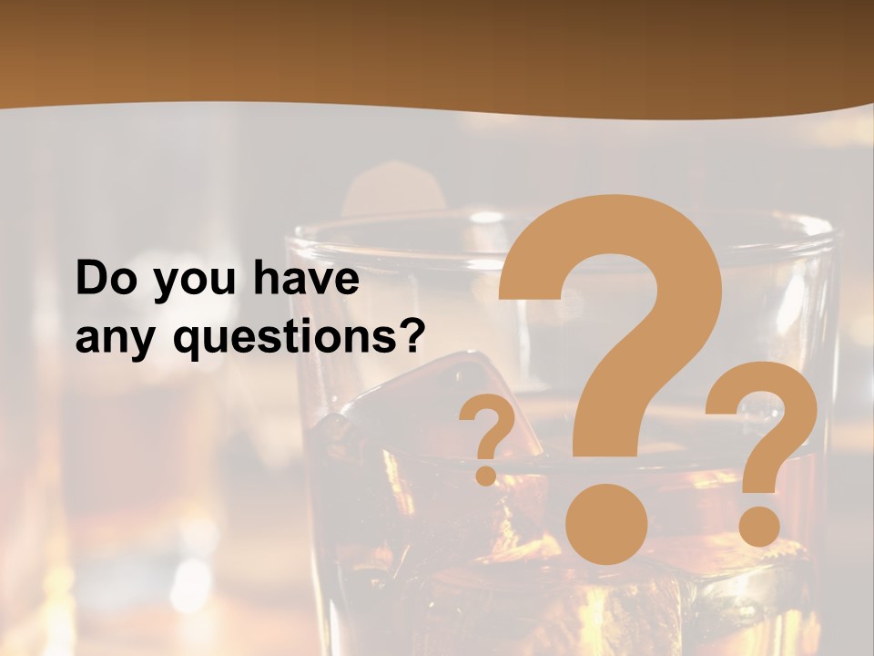 A Glass Of Whiskey With Ice On A Table PowerPoint Template