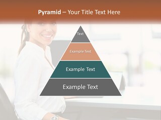 A Woman Sitting At A Desk With A Laptop PowerPoint Template