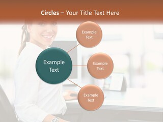 A Woman Sitting At A Desk With A Laptop PowerPoint Template