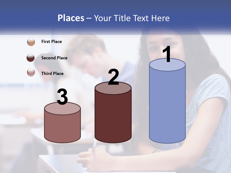 A Woman Sitting At A Desk In A Classroom PowerPoint Template