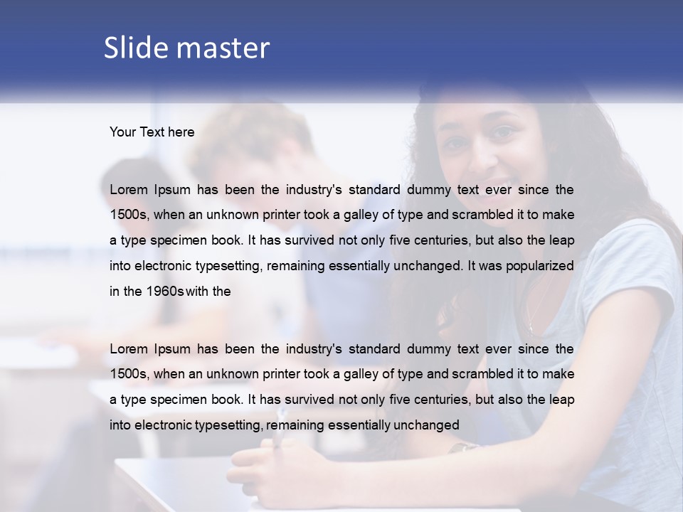 A Woman Sitting At A Desk In A Classroom PowerPoint Template