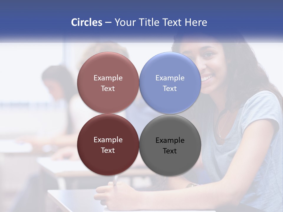 A Woman Sitting At A Desk In A Classroom PowerPoint Template