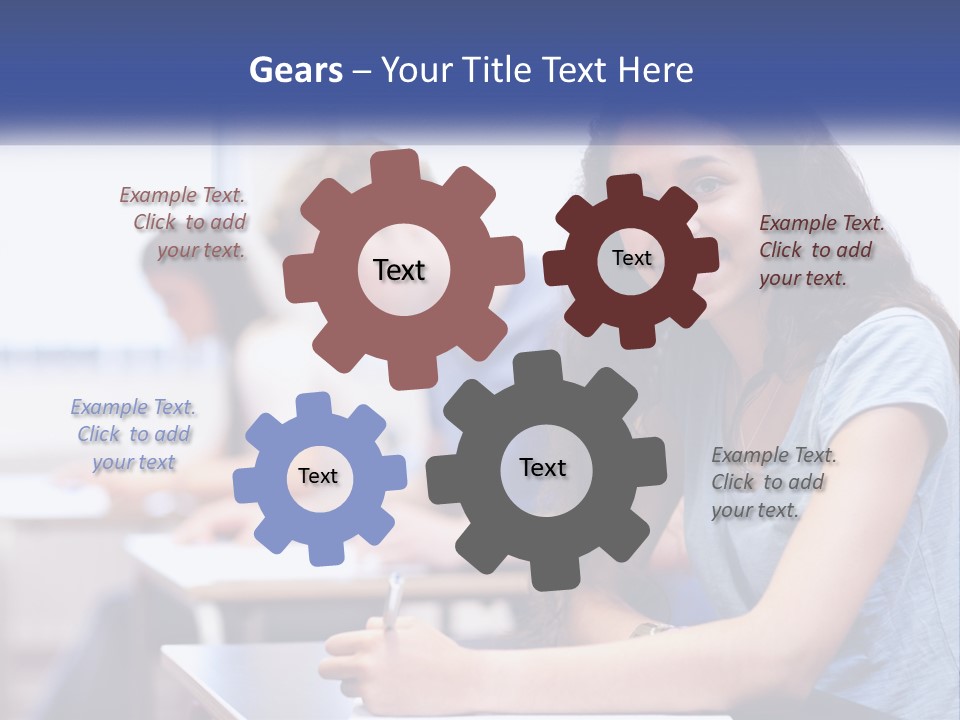 A Woman Sitting At A Desk In A Classroom PowerPoint Template