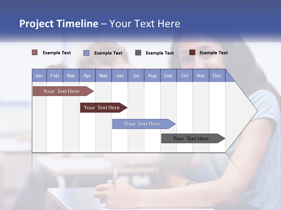A Woman Sitting At A Desk In A Classroom PowerPoint Template