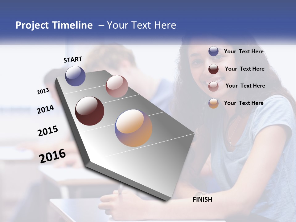 A Woman Sitting At A Desk In A Classroom PowerPoint Template
