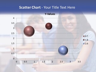 A Woman Sitting At A Desk In A Classroom PowerPoint Template