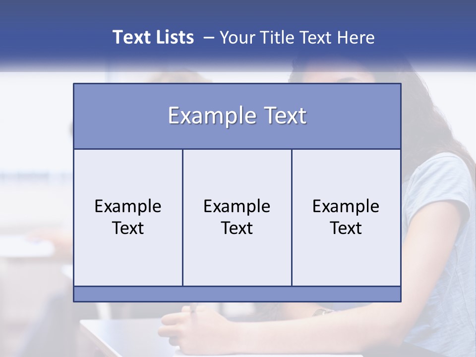 A Woman Sitting At A Desk In A Classroom PowerPoint Template