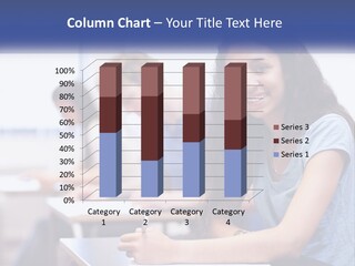 A Woman Sitting At A Desk In A Classroom PowerPoint Template