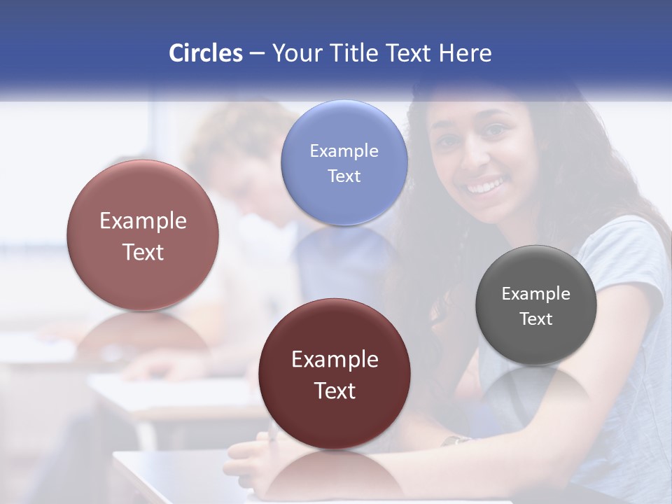 A Woman Sitting At A Desk In A Classroom PowerPoint Template