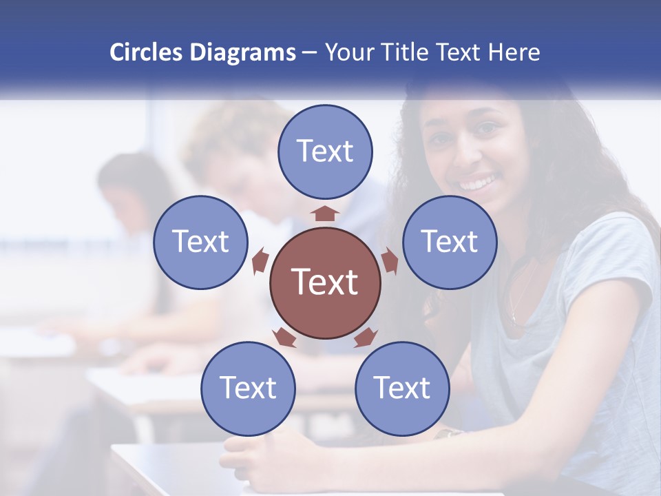 A Woman Sitting At A Desk In A Classroom PowerPoint Template