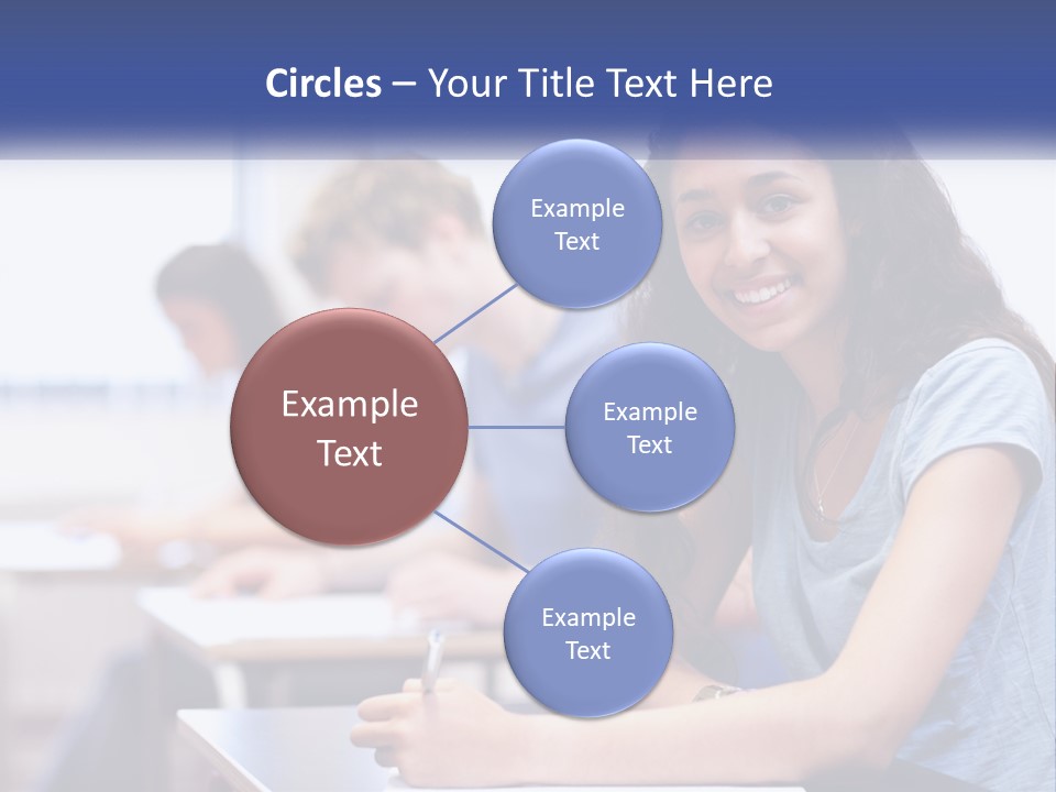A Woman Sitting At A Desk In A Classroom PowerPoint Template