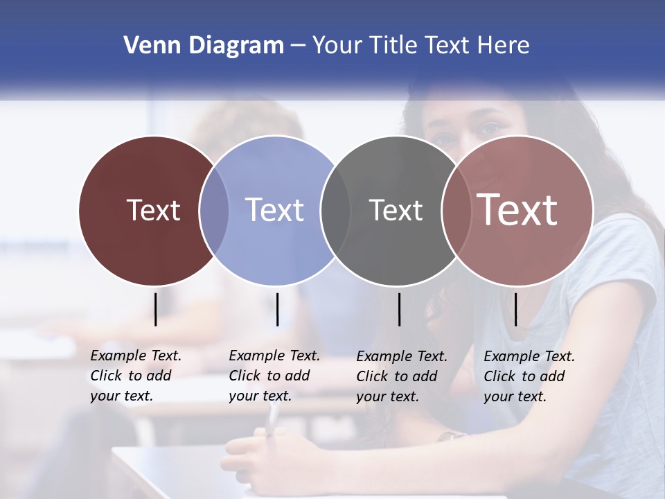 A Woman Sitting At A Desk In A Classroom PowerPoint Template
