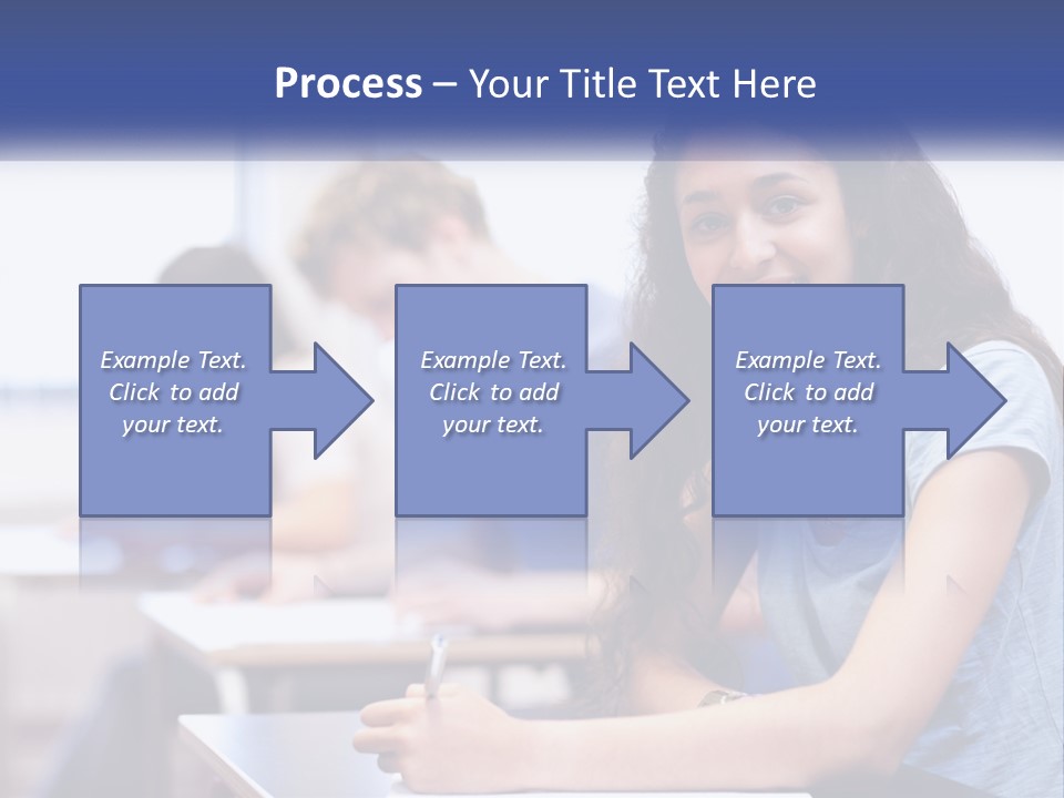 A Woman Sitting At A Desk In A Classroom PowerPoint Template