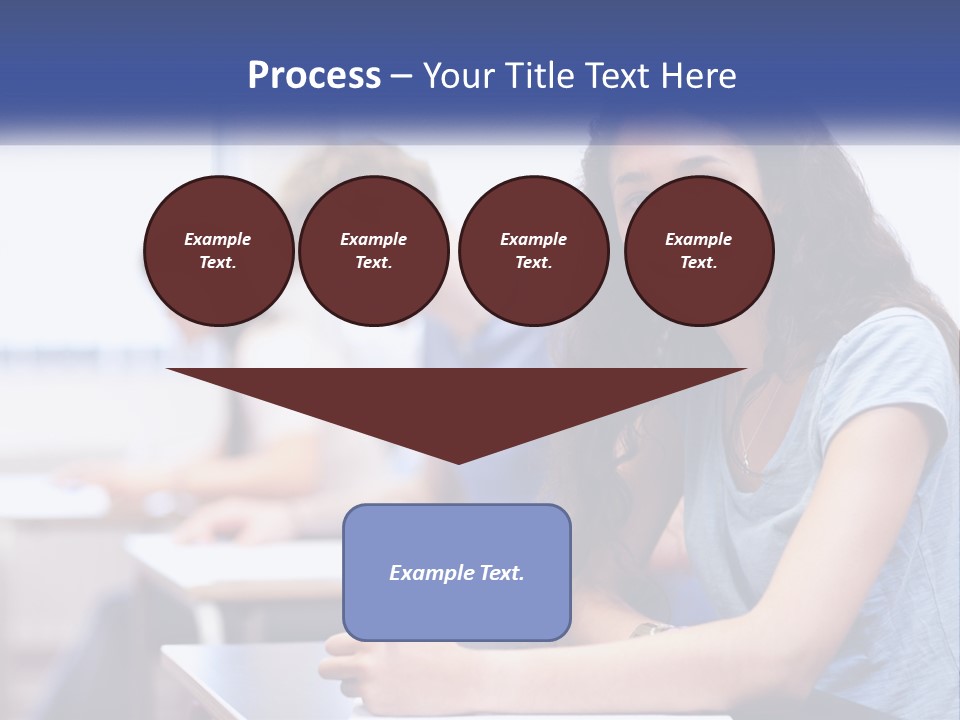 A Woman Sitting At A Desk In A Classroom PowerPoint Template