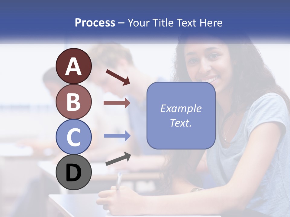 A Woman Sitting At A Desk In A Classroom PowerPoint Template
