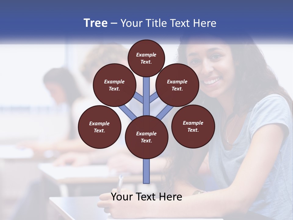 A Woman Sitting At A Desk In A Classroom PowerPoint Template